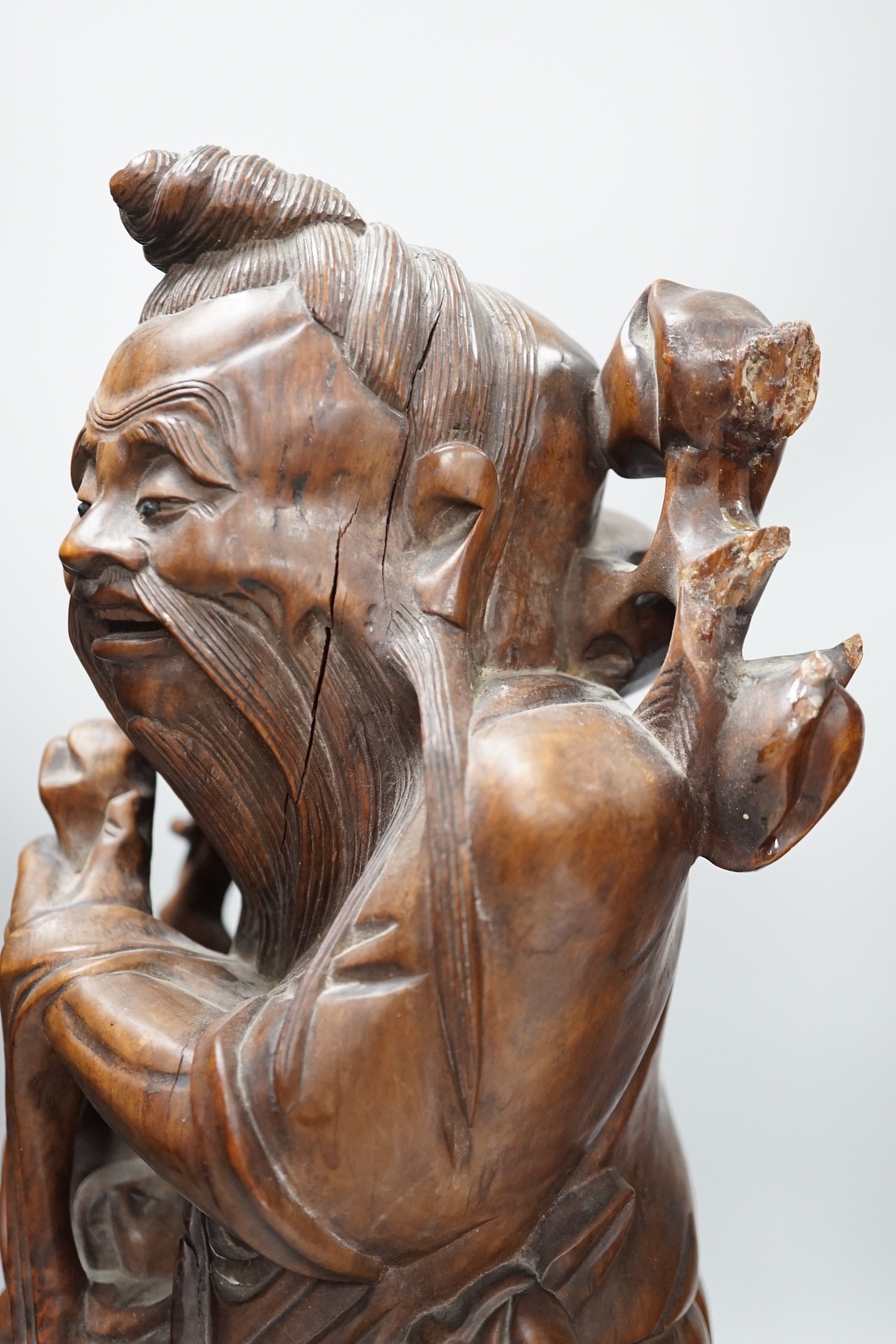 Two Chinese hardwood figures of luohans, early 20th century Tallest 48cm